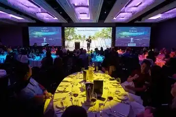 Corporate event setup with elegant tables and professional atmosphere