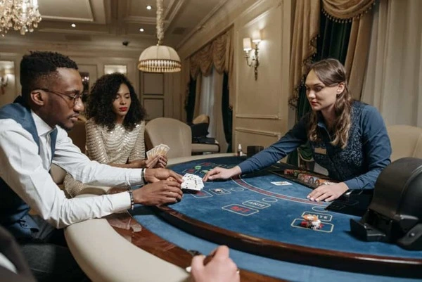 Guests interacting at a poker-inspired event with premium evening atmosphere